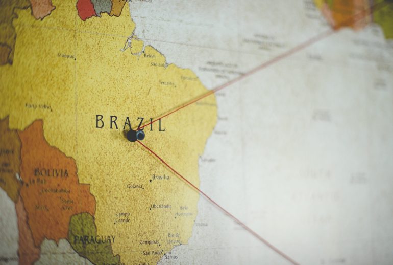 A closeup shot of a black pin on the Brazil country on the map